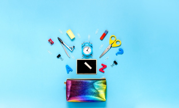 Photo school supplies on a blue background