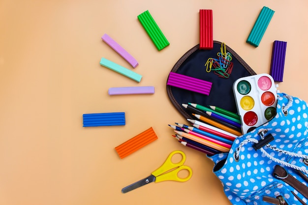 Photo school supplies fall out of backpack