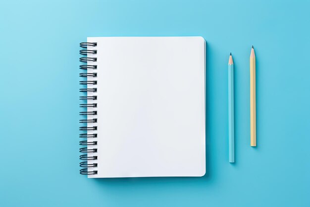 School supplies including notebooks and stationery displayed on a blue background to represent educa