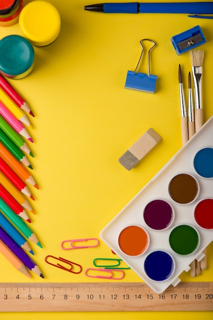 School supplies isolated on yellow