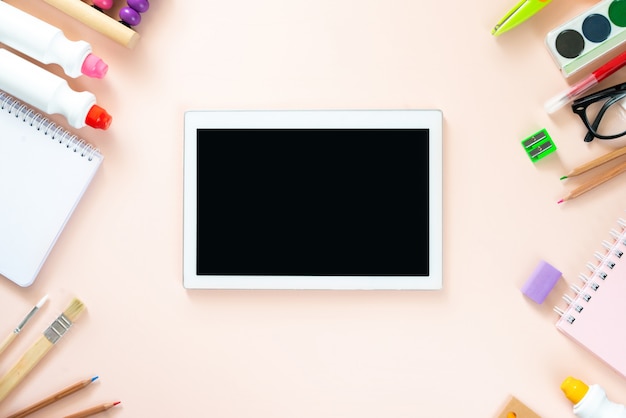 School supplies on light pink background