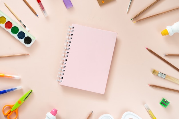 School supplies on light pink background