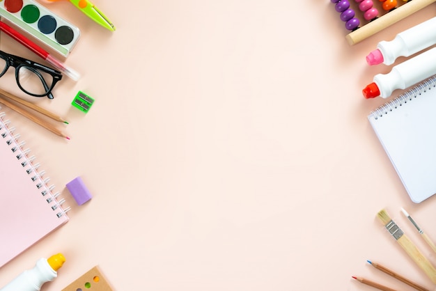 School supplies on light pink background