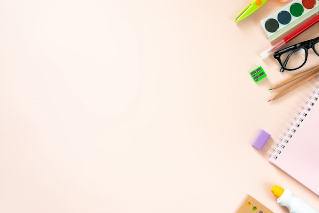 School supplies on light pink background