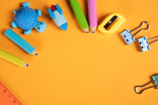 School supplies on orange background