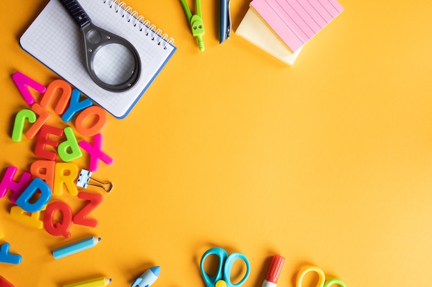 school supplies on orange background