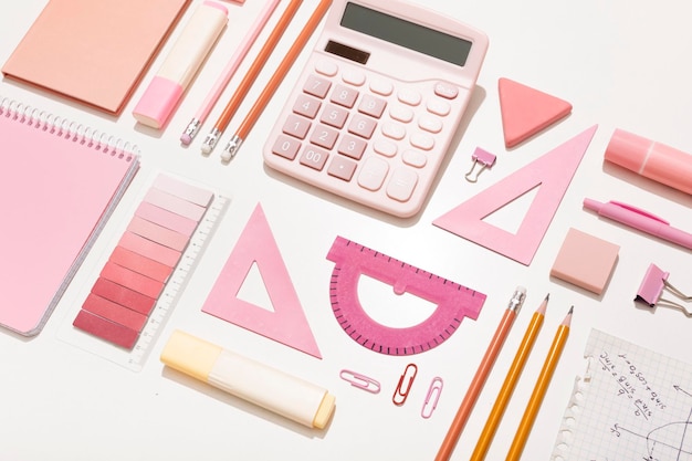 School supplies in pink colors on a white background Preparation for school