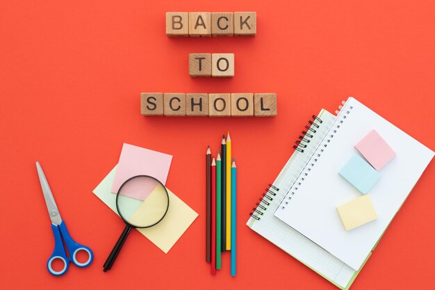 School supplies on red top view back to school