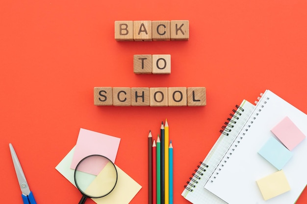 School supplies on red Top view Back to school