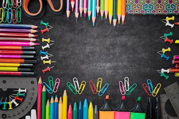 School supplies shaped frame on the blackboard