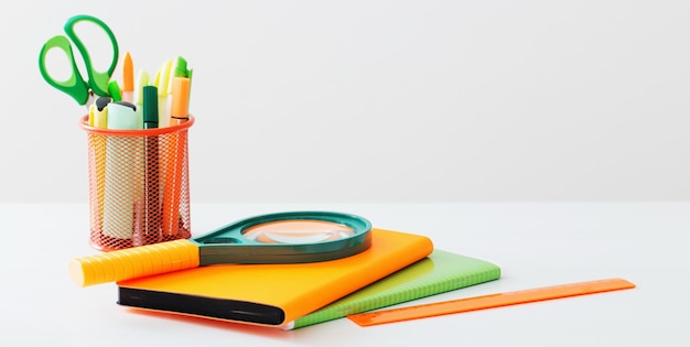 School supplies on white table