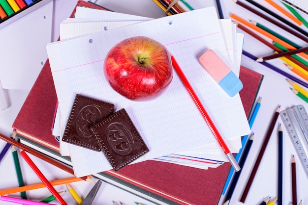 School supplies with an apple