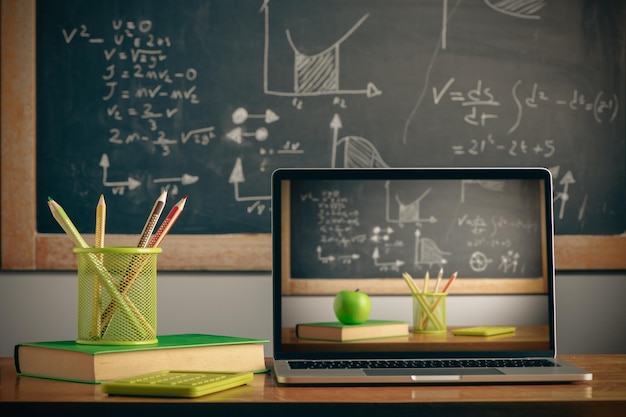 School supplies with digital laptop on wooden table