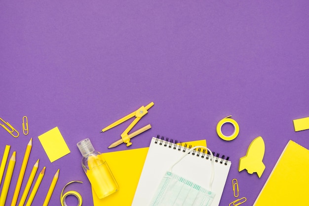 School supplies with purple background