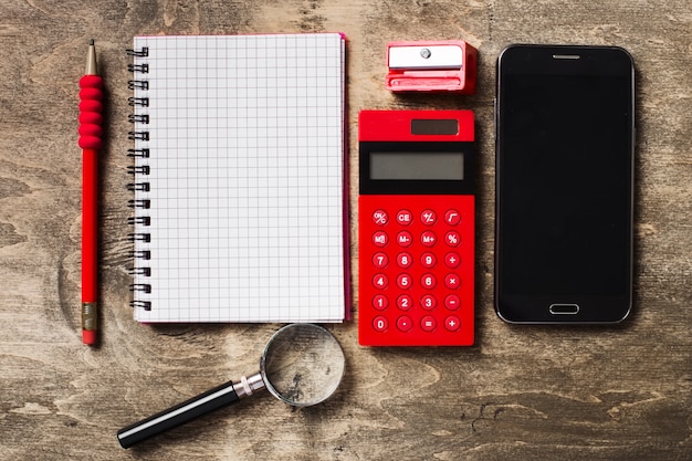 Photo school supplies on wood background. flat layout.