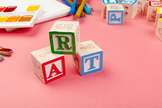 Photo school supplies and wooden alphabetical cubes