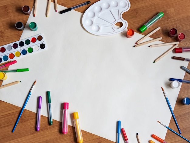 School supplies on a wooden desk background