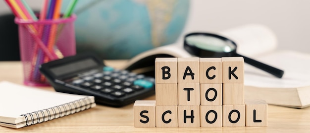 School supplies on wooden table background Back to school conceptxA