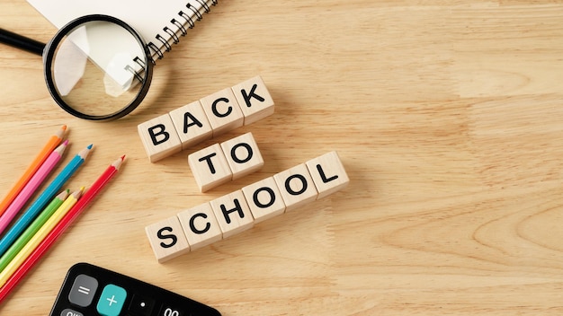 School supplies on wooden table background Back to school conceptxA