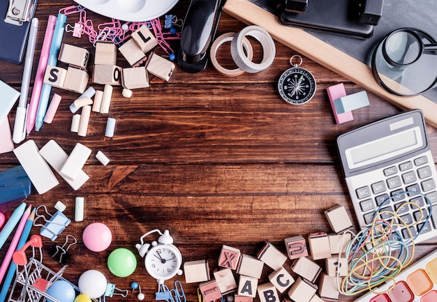 Photo school supplies on wooden top view, flat lay