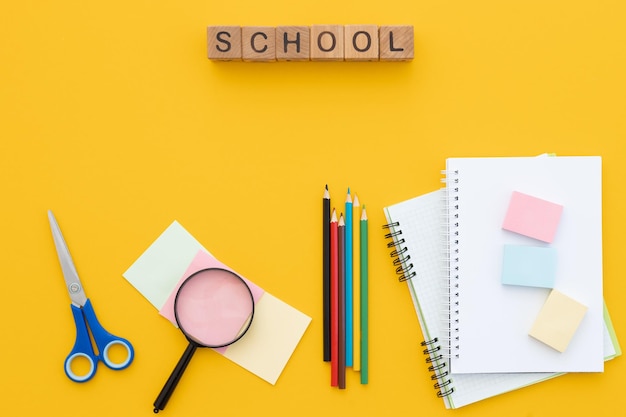 School supplies on yellow background Top view Copy space