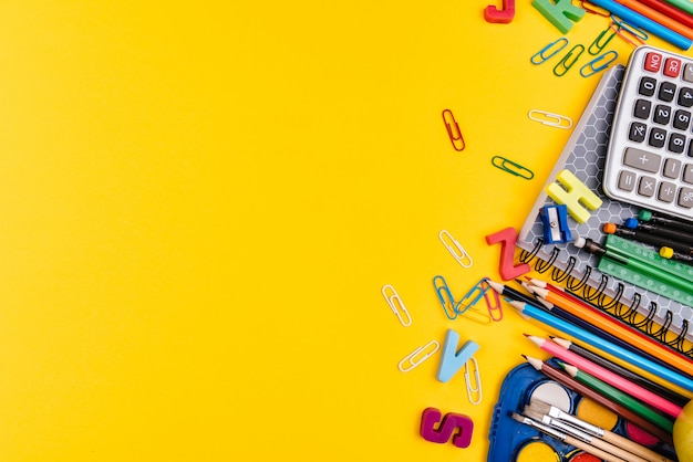 School supplies on yellow background