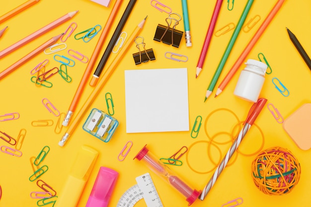 School supplies on yellow background