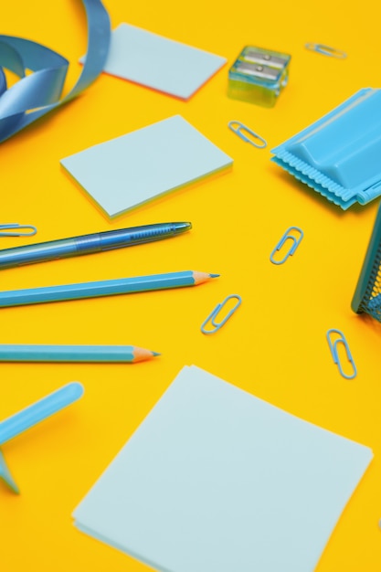 Photo school supplies on yellow background