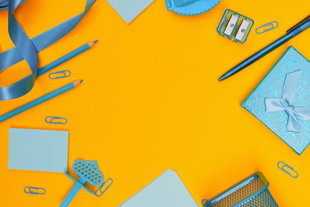 School supplies on yellow background