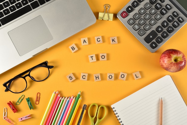 School supplies on yellow paper. Education or Back to school concept.