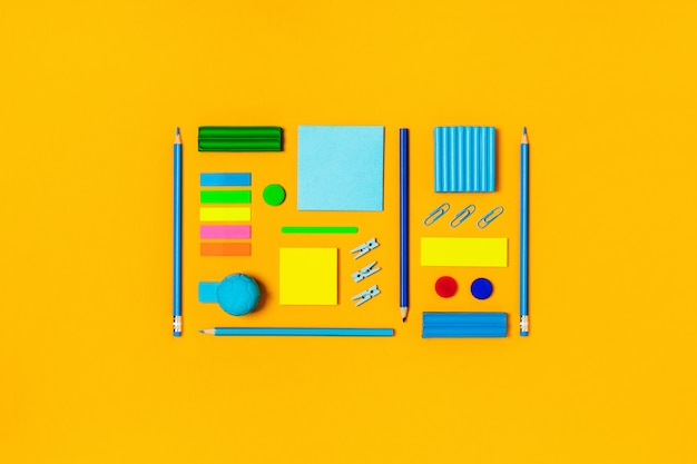 Photo school supplies on a yellow.