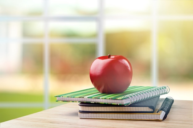 School table with stack of books