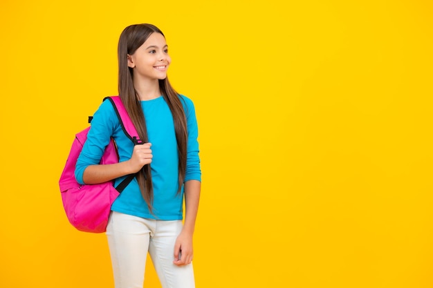 School teen with backpack Teenager student isolated background Learning and knowledge Go study Education concept Happy teenager portrait Smiling girl