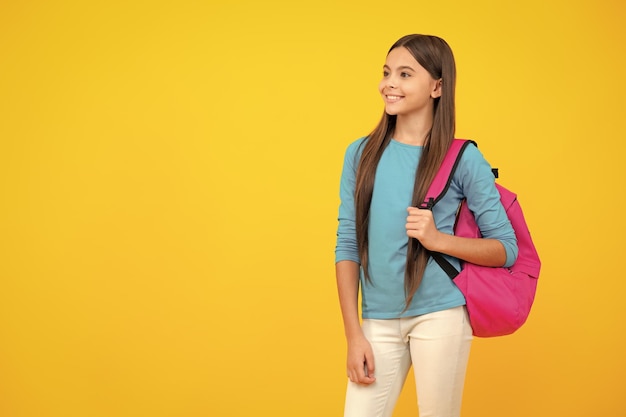 School teen with backpack Teenager student isolated background Learning and knowledge Go study Education concept Happy teenager portrait Smiling girl