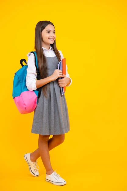 School teenage girl with book and copybook teenager schoolgirl student isolated background learning