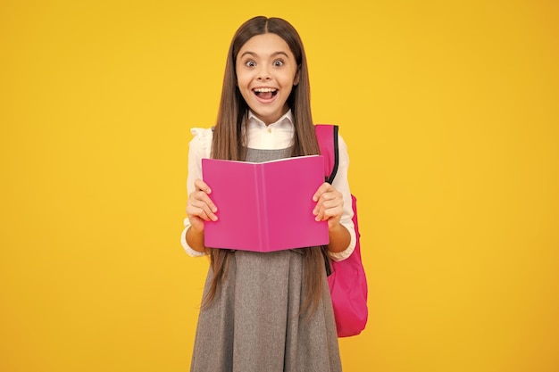 School teenager child girl 12 13 14 years old with book and copybook teenager schoolgirl on isolated background learning and knowledge education concept