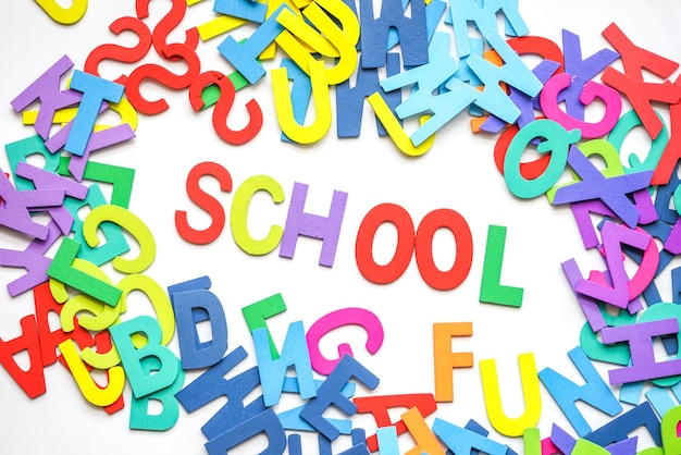 School text with colorful alphabets on white background