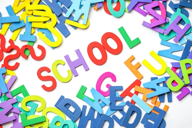 School text with colorful alphabets on white background
