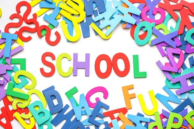 School text with colorful alphabets on white background