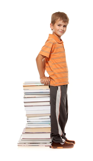 Schoolboy and books isolated on a white