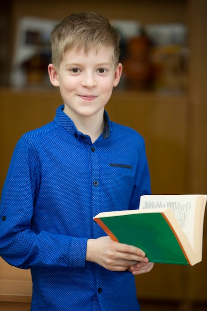 Schoolboy middle school student with a book