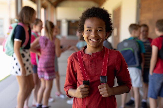 Schoolboy standing in the schoolyard at elementary school