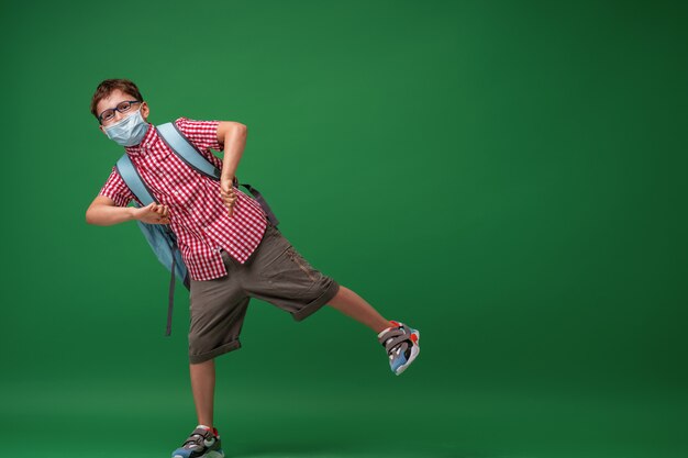 Schoolboy wearing a protective mask