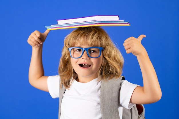 Schoolchild in school uniform with backpack teen student on isolated background