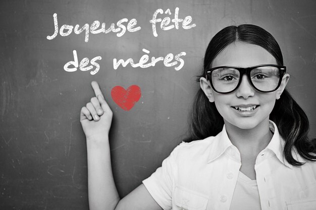 Schoolchild with blackboard against french mothers day message