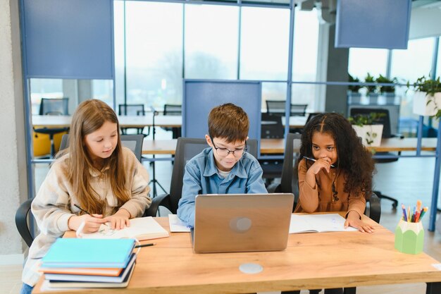 Schoolchildren for a laptop at school