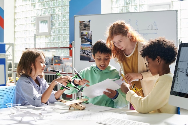 Schoolchildren reading manual