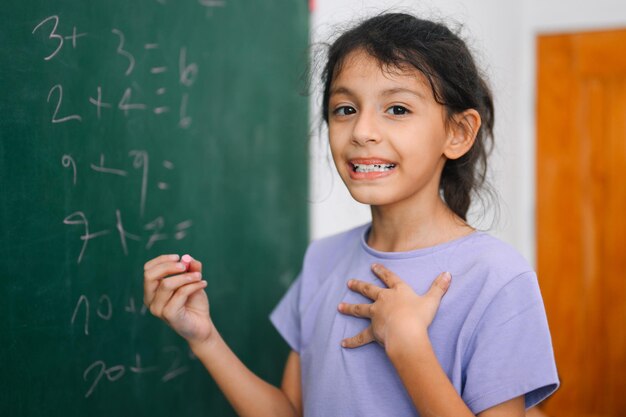 Schoolgirl children studying and learning lesson in classroom Back to school Kids with education