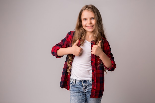 schoolgirl girl with thumbs up