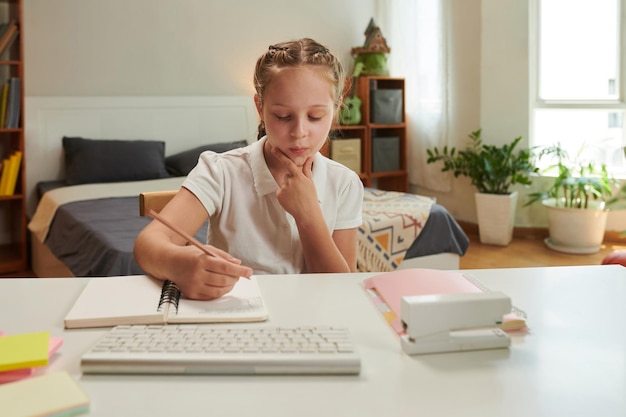 Photo schoolgirl solving equations